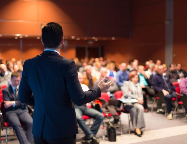 man-speaking-at-a-business-conference-picture-id499517325